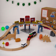 The Dino Land | Playbox The Dino Land | Third Set-1 Including (Police Jeep,1 Car,1 Boat,2 Dinosaurs,3 Stones,1 Signal,4 Plastic Attachment,12 Tracks and1 Large Bridge)