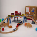 The Dino Land | Playbox The Dino Land | Third Set-1 Including (Police Jeep,1 Car,1 Boat,2 Dinosaurs,3 Stones,1 Signal,4 Plastic Attachment,12 Tracks and1 Large Bridge)