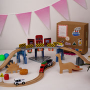 The Dino Land | Playbox The Dino Land | Third Set-1 Including (Police Jeep,1 Car,1 Boat,2 Dinosaurs,3 Stones,1 Signal,4 Plastic Attachment,12 Tracks and1 Large Bridge)